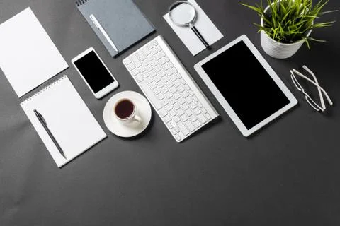 Top view of workplace with digital devices Stock Photos