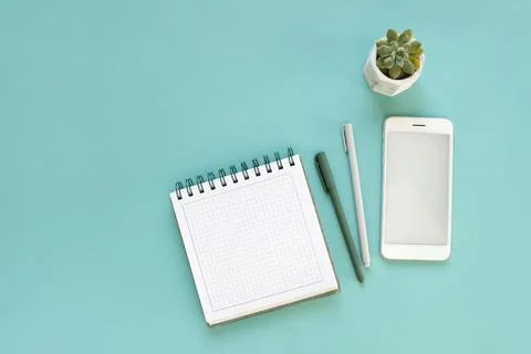 Top view of workspace and opened notebook with mock up blank pages Stock Photos