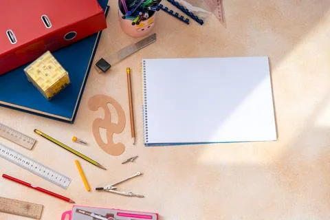 Top View Workspace with Blank Spiral Notebook Rulers and Engineering Drawing Foto stock
