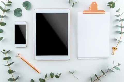 Top view workspace, notebook, blank clipboard, pen. Freelancer workplace concept Stock Photos