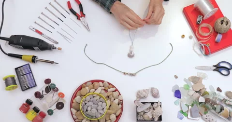 Top view on workspace table at craft workshop with tools and materials. Stock Footage 143194160