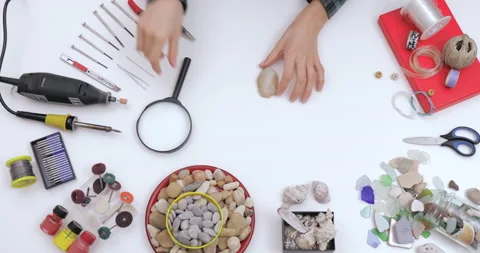 Top view on workspace table at craft workshop with tools and materials. Stock Footage 143197603