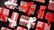 Top View Of Wrapped Christmas Presents Laid On The Black Background Stock Footage