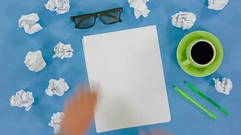 Top view of writing concept with pens, coffee cup, notepad and crumpled paper Stock Footage 77374242