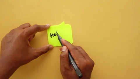 Top view of writing hello on a note Stock Footage 314410330