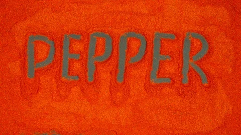 TOP VIEW: Writing of Pepper word on a red pepper background Stock Footage 121943191