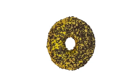 Top view of a yellow donut with chocolate spinkles spinning around 360 degree Stock Footage 150705550