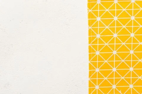 Top view with yellow empty kitchen napkin isolated on table background. Fol.. Stock Photos