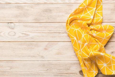 Top view with yellow empty kitchen napkin isolated on table background. Fol.. Stock Photos