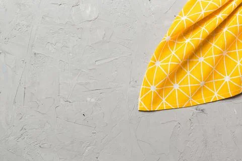 Top view with yellow empty kitchen napkin isolated on table background. Fol.. Stock Photos