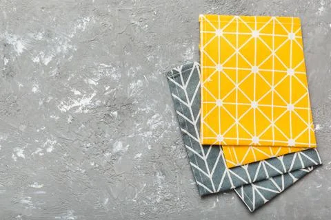Top view with yellow empty kitchen napkin isolated on table background. Fol.. Stock Photos