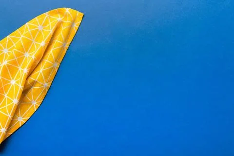 Top view with yellow empty kitchen napkin isolated on table background. Fol.. Stock Photos