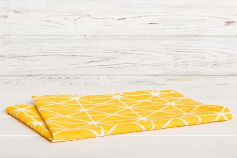 Top view with yellow empty kitchen napkin isolated on table background. Fol.. Stock Photos
