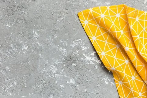 Top view with yellow empty kitchen napkin isolated on table background. Folde Stock Photos