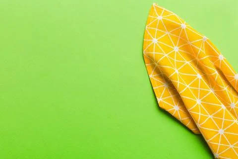 Top view with yellow empty kitchen napkin isolated on table background. Fol.. Stock Photos