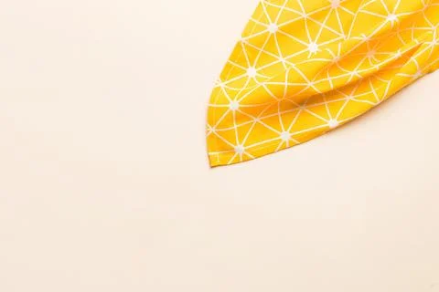 Top view with yellow empty kitchen napkin isolated on table background. Fol.. Stock Photos
