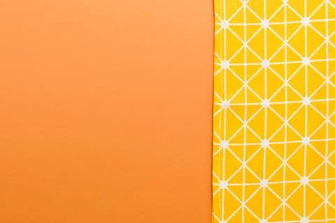 Top view with yellow empty kitchen napkin isolated on table background. Fol.. Stock Photos