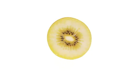 Top view of a yellow kiwi fruit cross-section cut rotating. Isolated on white Stock Footage 166226818