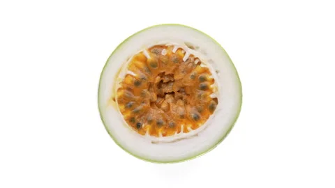 Top view of yellow passion fruit cross cut rotating on white background. Stock Footage 159156252