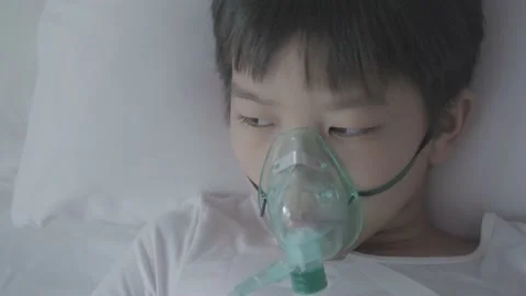 Top view Young asian boy with oxygen mask  Stock Footage 137158907