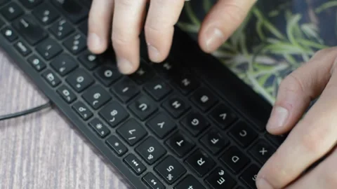 Top view young businessman work typing on computer typeboard. Vídeo Stock 263136911