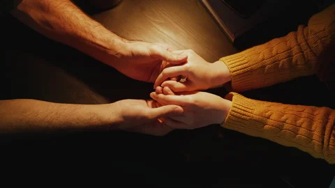 Top view of young couple holding hands during romantic date, close relationship Stock Footage 340266849