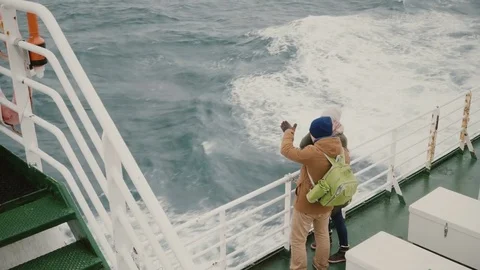 Top view of young couple standing on the board of the ship. Man and woman with Video stock 82956394