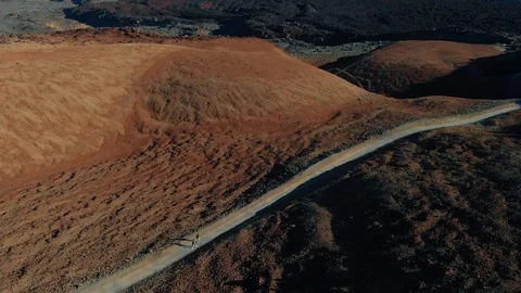 Top view of a young couple walking along a trekking route at the base of a Stock-Footage 111247332