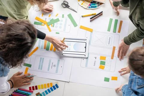 Top view of young creative professional software developers discussing sketches Stock Photos