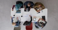 Top View Young Diverse Team Of Web Developers Brainstorming Ideas For Startup Stock Footage