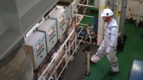 Top view young engineer in white work suit checks the indicators Stock Footage 119986509