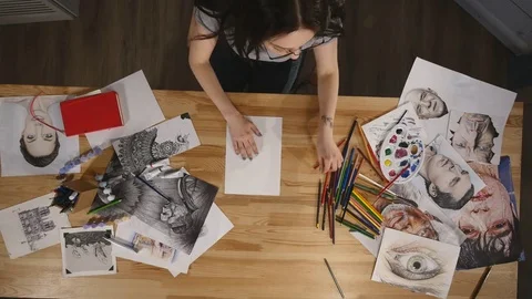 Top view young girl draws with pencils Stock Footage