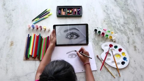 Top view of young girl learning drawing sketch using tablet and sketchbook Stock Footage 131800918