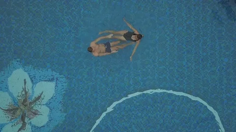 Top view of young man and young brunette girl swimming in the pool Stock Footage 97907605