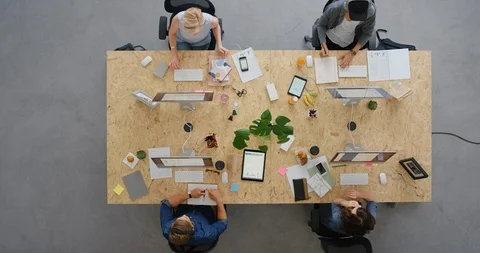 Top view young multi ethnic business team in vibrant office workspace diverse Stock Footage