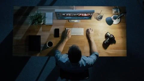 Top View of a Young Photographer Processing Photographs on His Desktop Computer Stock Photos