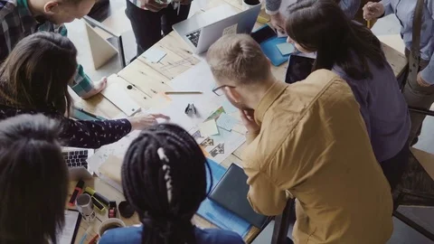 Top view of young team working on new project. Group of mixed race people Stock Footage 75530595