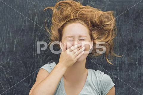 Top view of a young woman with space for text and symbols on the old wooden.. Stock Photos