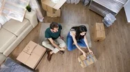 Top View Young Woman Unpacking From Cardboard Boxes Stock Footage