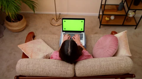 Top View Of Young Woman Using Laptop With Green Screen Typing On Keyboard Stock Footage 147008567