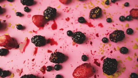 Top view zoom out of a table with berries in a pink background Stock Footage 140041871