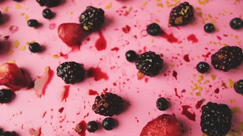 Top view zoom in on a table with berries in a pink background Stock Footage 140041882