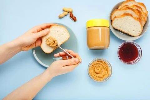 Top view,flat lay process of cooking breakfast, spreading bread, toast with p 写真素材