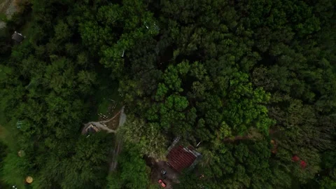 Top view,flying over a small camping in forest at a daytime. cloudy Stock Footage 252737699