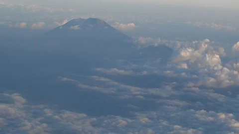 Top of volcano coming out of clouds 스톡 동영상 112482825