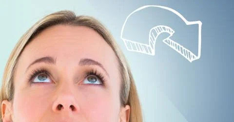 Top of woman's head looking at 3D white downward arrow against blue background 스톡 사진
