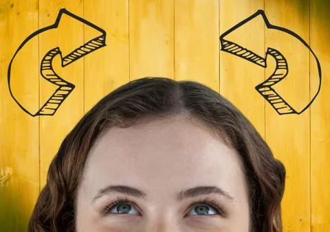 Top of woman's head looking up at 3D grey curved arrows against yellow wood Stock Photos