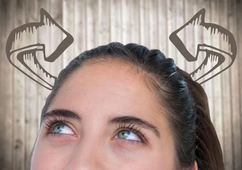 Top of woman's head looking at 3D curved arrows against blurry wood panel Stock Photos