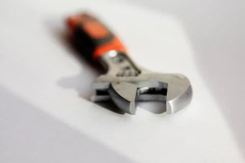 The top of a wrench is in sharpness, it is on a white background Stock Photos