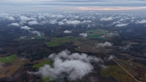 Topdown Aerial of Clouds Spilling Across Farmland Patchwork Stock Footage 326280794